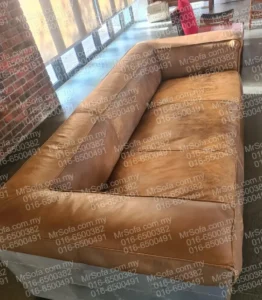 Worn Aircraft Riveted leather brancaster sofa before restoration by Mr Sofa in Taman U Thant KL